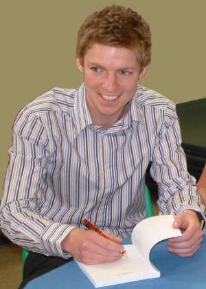 Paul Withyman signing copies of the book at its launch party in June 2003.